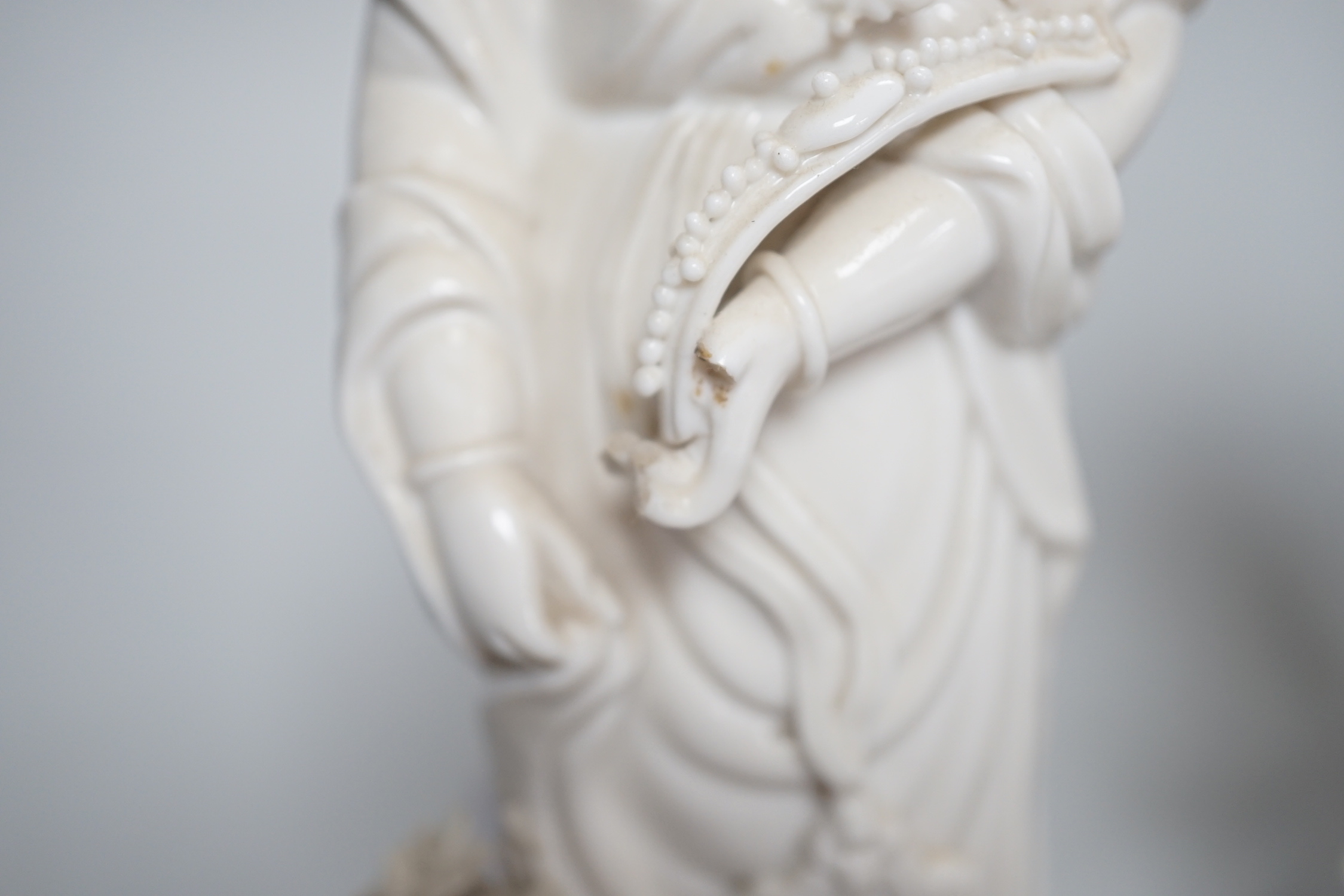 Three Chinese blanc de chine figures of Guanyin, 25cm